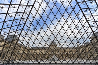View from inside the pyramid to the buildings of the Louvre