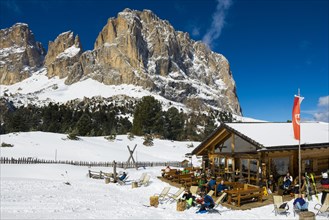 Snow-covered mountains and ski hut