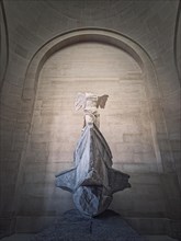 Winged Victory of Samothrace statue in the hall of Louvre museum