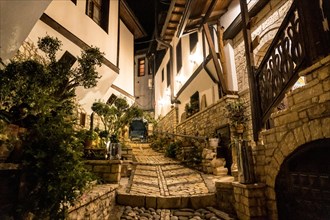 Footpath through the streets of the illuminated historical city of Berat in Albania