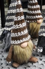 Dwarfs with long beards and huge woolly hats in a garden centre