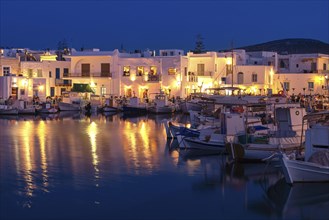 Traditional Greek fishing village and harbour after sunset