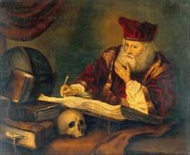 Doctor in his practice with textbooks and a skull. A man who is Nicholas Alcocke