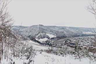 Snow covered landscape of Mosel Valley and river