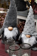 Dwarfs with long beards and huge woolly hats in a garden centre