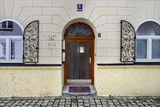 Restored old building facade with wooden door