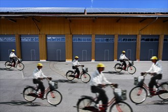 Warehouse with solar panels and cyclists