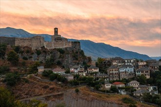 Sunset over the clock tower and Gjirokaster fortress