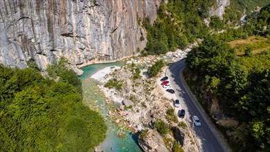 Aerial drone view of small beach on turquoise river of Valbona valley