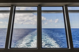 View through the rear window of a cruise ship Sea