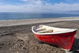 Red boat on Las Salinas de Cabo de Gata beach