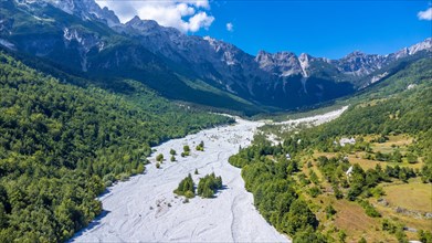 Aerial drone view of Valbona valley and dry river in summer