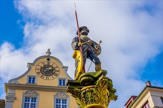 Middle Ages City with Statue and a Clock on a Building in a Sunny Day in Schaffhausen in Switzerland