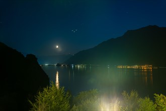 View over Lake Brienz with Mountain and Moon in Dusk in Giessbach