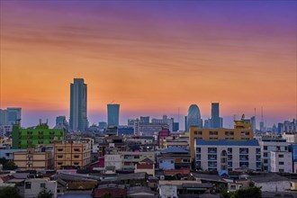 Colorful sunset over big city