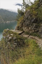 Hiking trail at the Achensee and view to the Achensee boat trip
