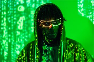 Photo with green neon light of a young afro man in futuristic glasses