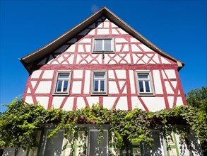 Half-timbered house with floral decorations