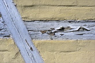 Half-timbered facade with peeling paint