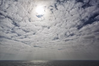 Sunbeams through cloud cover