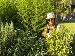 Woman in herb bed