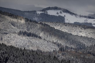 Fresh snow in November with a wonderful view of the Black Forest in a cloudy atmosphere