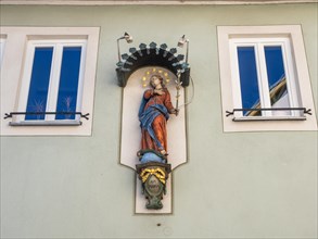 Statue of the Virgin Mary on a house facade