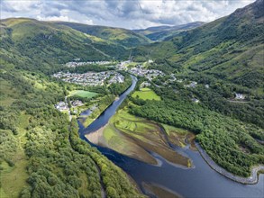 Aerial view of the village of Kinlochleven with the mouth of the River Leven at the eastern part of the freshwater loch Lochleven