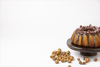 Vegan hazelnut cake on wooden serving plate