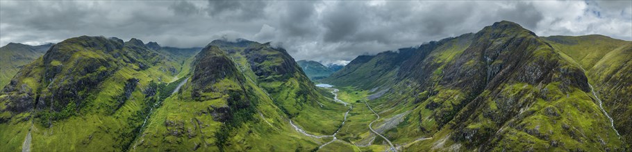 Aerial panorama of the prominent mountain range and the three peaks of Three Sisters of Glen Coe