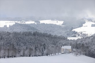 Fresh snow in November with a view of the Ohmen Chapel