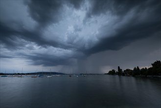 Light thunderstorm with rain shower with sailing boats