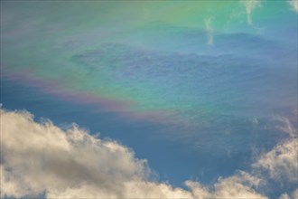 Quite rare optical phenomenon of iridescence of clouds of pearly