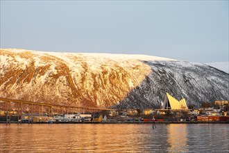 View over the harbour with Tromsobrua or Tromso Bridge