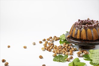 Vegan hazelnut cake on wooden serving plate