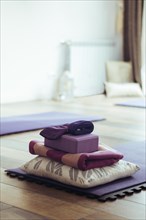 Empty yoga studio interior with mats and accessories. Copy space. Vertical shot