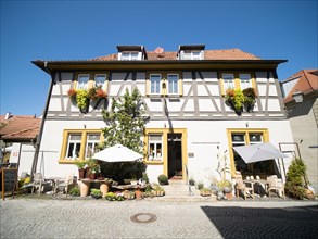 Half-timbered house with floral decorations
