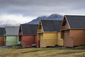 Colourful wooden houses in the settlement of Longyearbyen in autumn