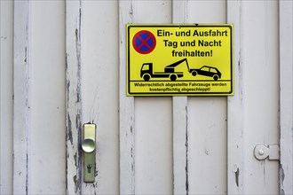 Wooden door with Schld -Keep exit clear-