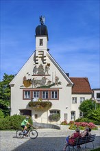 The town hall with cyclist