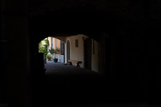 Old Beautiful Street Tunnel with Arch and House and with Sunlight in Brusino Arsizio Ticino