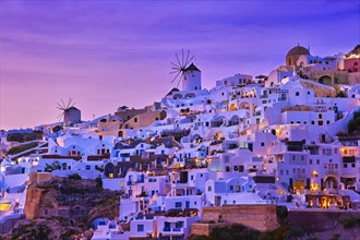 Beautiful view of Oia village with traditional whitewashed houses and windmills