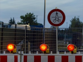 Red warning lights and warning barriers