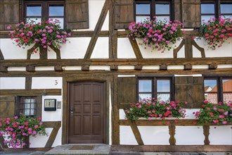 Half-timbered facade with geraniums