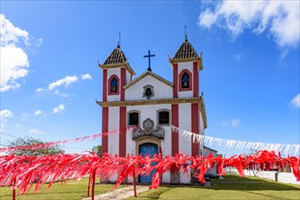 Historic church decorated with colorful ribbons for religious celebrations in the city of Lavras Novas in Minas Gerais