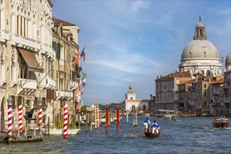 Boat traffic on the Grand Canal with the church of Santa Maria della Salute
