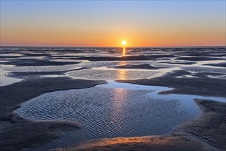 Colourful sunset over beach of the Wadden Sea National Park