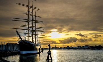 Museum sailing ship Passat at sunset in Priewall harbour