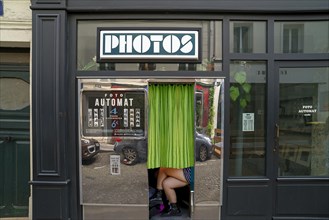 Photo booth in the facade of a photo shop Paris