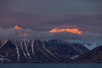 Mountains at sunset along the Hornsund fjord at Spitsbergen